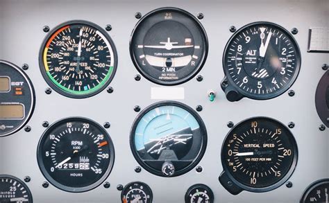 general aviation cockpit panel showing tachometer and hobbs meter in situ