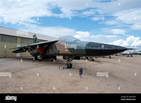 General Dynamics F-111 Aardvark variable sweep wing strike aircraft flying low altitude