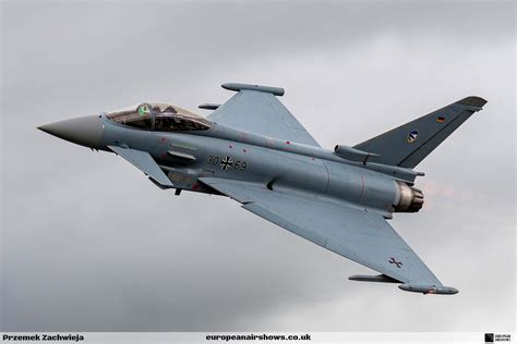 German Air Force Eurofighter Typhoon fighter jet flying over European landscape