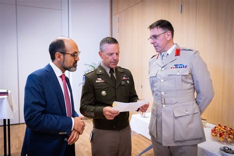 German defense officials reviewing ALIS data protocols during NATO logistics summit in Brussels, 2019