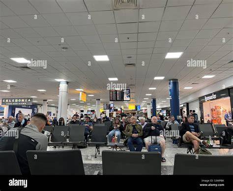 Glasgow Airport terminal departure hall with United transatlantic passengers