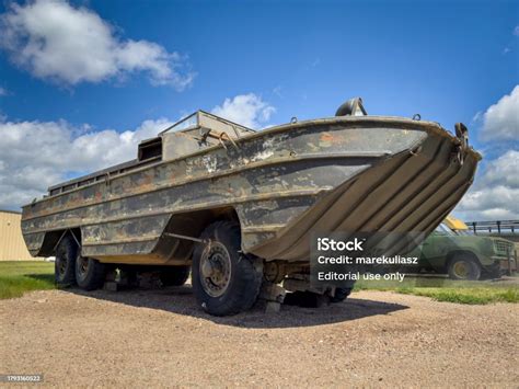 GMC DUKW Duck amphibious World War II military truck entering water