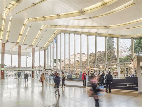 Grand hall of Roma Termini station with travelers