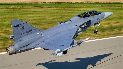 gripen fighter jet taking off from snow-covered airstrip in northern sweden