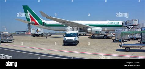 Ground handling crew at Rome Fiumicino Airport apron during labor strike