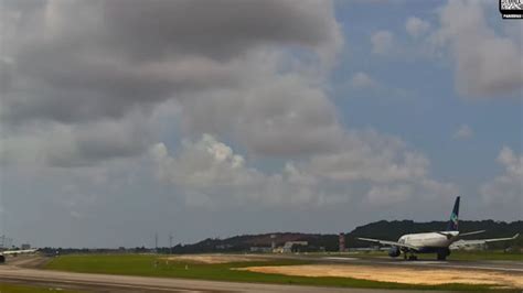Guararapes Airport during stormy weather as Azul aircraft prepare for departure