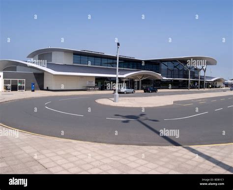 Guernsey Airport terminal and runway with Channel Islands coastline