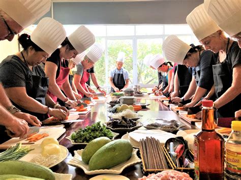 guests participating in cooking workshop at icy strait point with tribal instructors