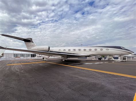 Gulfstream G700 private jet on runway, business class jet at Mach 0.935
