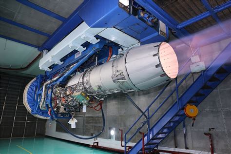 Hanwha Aerospace engineers inspecting KF-21 F414 engine module pre-installation