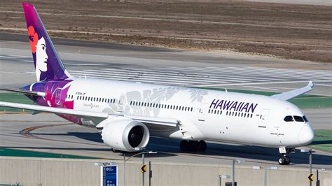 Hawaiian Airlines Boeing 787-9 in flight over Pacific Ocean with Mount Rainier in background