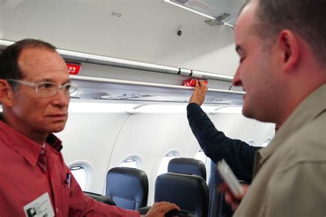 hearing impaired passenger boarding Delta flight with assistance from staff