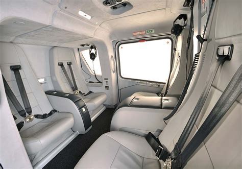 helicopter cabin interior with Chicago skyline visible through wraparound windows