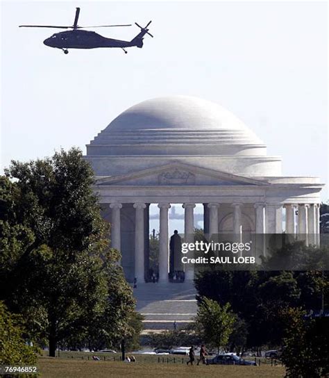 helicopter flying near Jefferson Memorial in springtime
