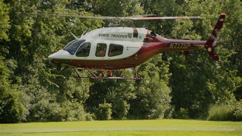 helicopter flying over Grant Park and museum campus at golden hour