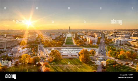 helicopter flying over National Mall at sunset