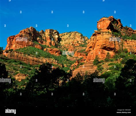 helicopter flying over Secret Mountain Wilderness with distant canyon layers