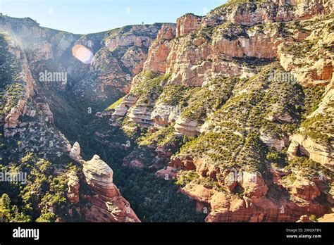 helicopter flying over sedona red rocks during golden hour
