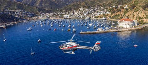Helicopter flying over the blue waters between Long Beach and Catalina Island