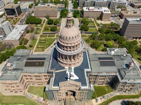 helicopter in flight above Texas State Capitol building in Austin