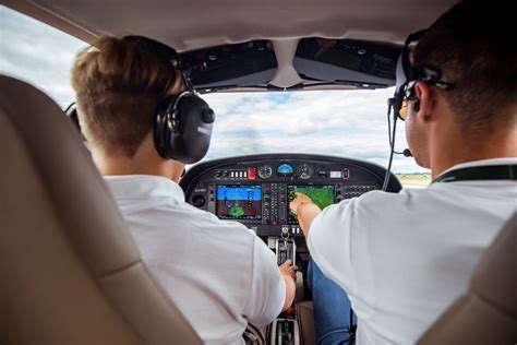 helicopter instructor guiding quick stop drill with student pilot