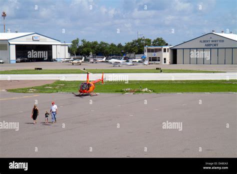 helicopter taking off from Albert Whitted Airport with marina in background