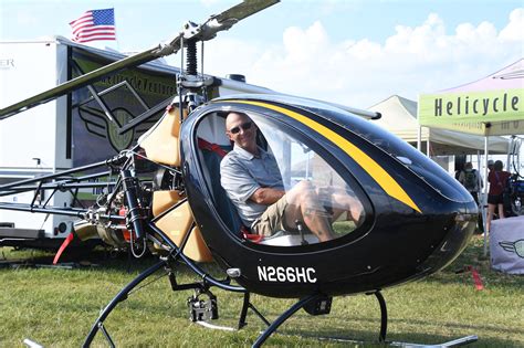 helicycle parked beside hangar at rural airstrip