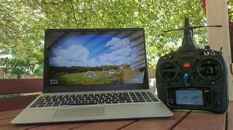 high-performance fpv drone simulator pc setup with radio and triple screen monitor