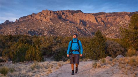 hikers in new mexico national park reviewing emergency app