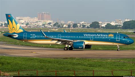 ho chi minh airport vietnam airlines aircraft at golden hour tarmac