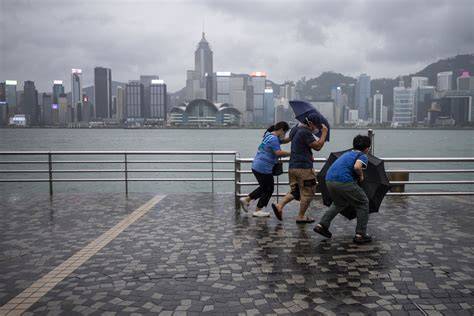 Hong Kong International Airport runway in heavy rain during Typhoon Saola