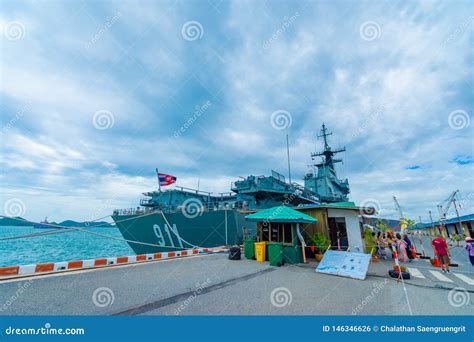 HTMS Chakri Naruebet moored at Sattahip Naval Base with Thai visitors touring