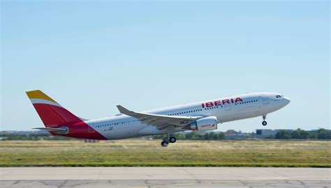 Iberia Airbus A330-300 taking off from Madrid with Orlando branding