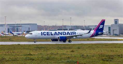 Icelandair Airbus A321LR departing New York JFK runway at sunset