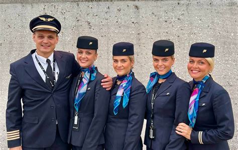 Icelandair flight attendants assisting passengers at PIT