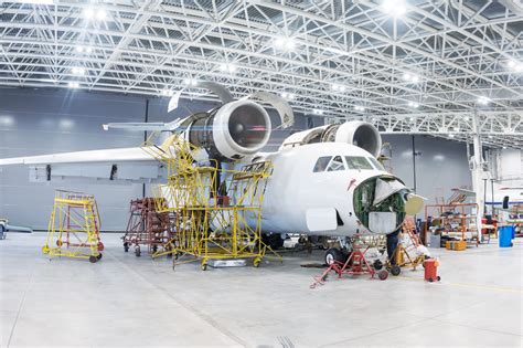 Indian MRO hangar facility with technicians inspecting underwing systems