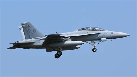 Indian naval officers inspecting F/A-18 Super Hornet mock-up at an airshow
