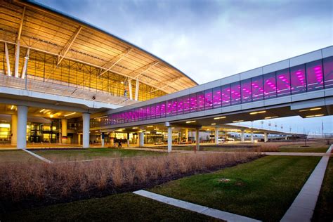 Indianapolis International Airport terminal hall with large glass windows and natural sunlight