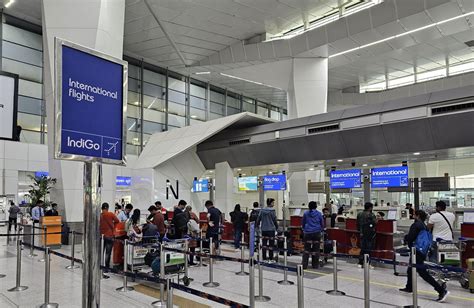 IndiGo check-in counters at Delhi IGI airport with international departures signage