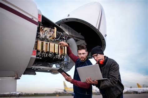 indigo ground maintenance crew inspecting a320neo engine in hangar