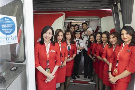 indonesia airasia crew and tourism ministry welcoming first adelaide flight passengers in bali terminal