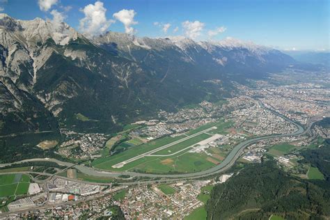 Innsbruck Airport alpine valley approach snowy mountains aircraft