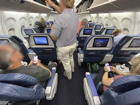 Interior cabin of Delta 757-200 showing first and comfort plus class seating