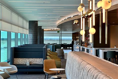 interior of a Delta Sky Club lounge with seating