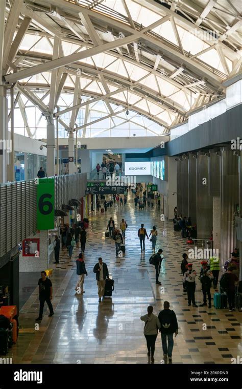 interior of Ciudad Juárez Airport terminal showing passenger traffic and gate activity
