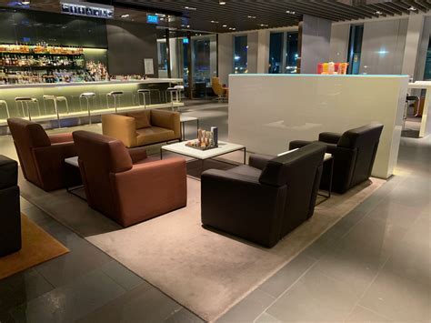 interior of lufthansa frankfurt first class terminal with whiskey bar and private seating