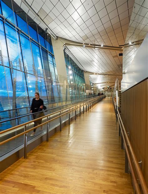 Interior of Oslo Airport showcasing wooden architecture and art installations