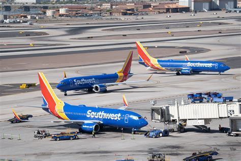 interior of southwest airlines terminal at pittsburgh with passengers and check-in kiosks