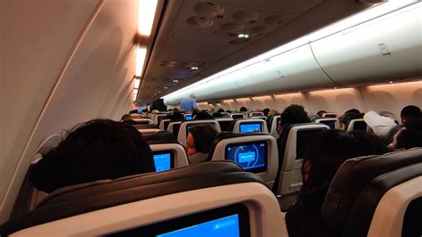 interior of united boeing 737 max 8 showing economy plus seating and inflight service