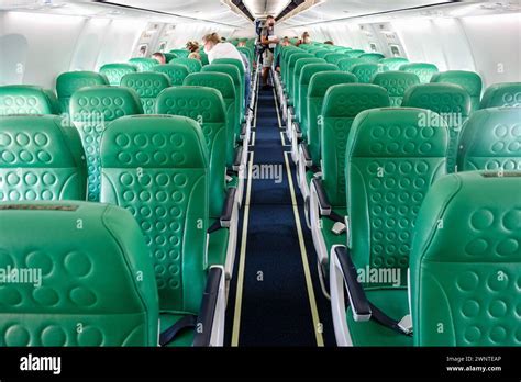Interior photo of a Transavia Boeing 737 showing messy cabin floor post-flight
